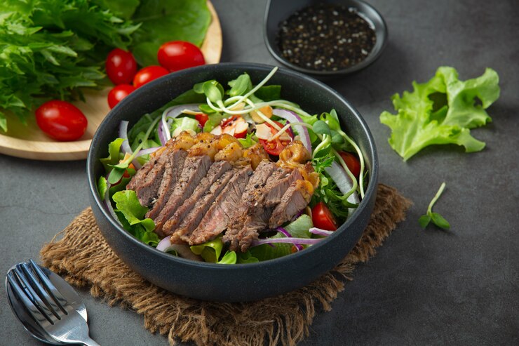 grilled-beef-steak-salad-with-vegetables-sauce-healthy-food_1150-37937